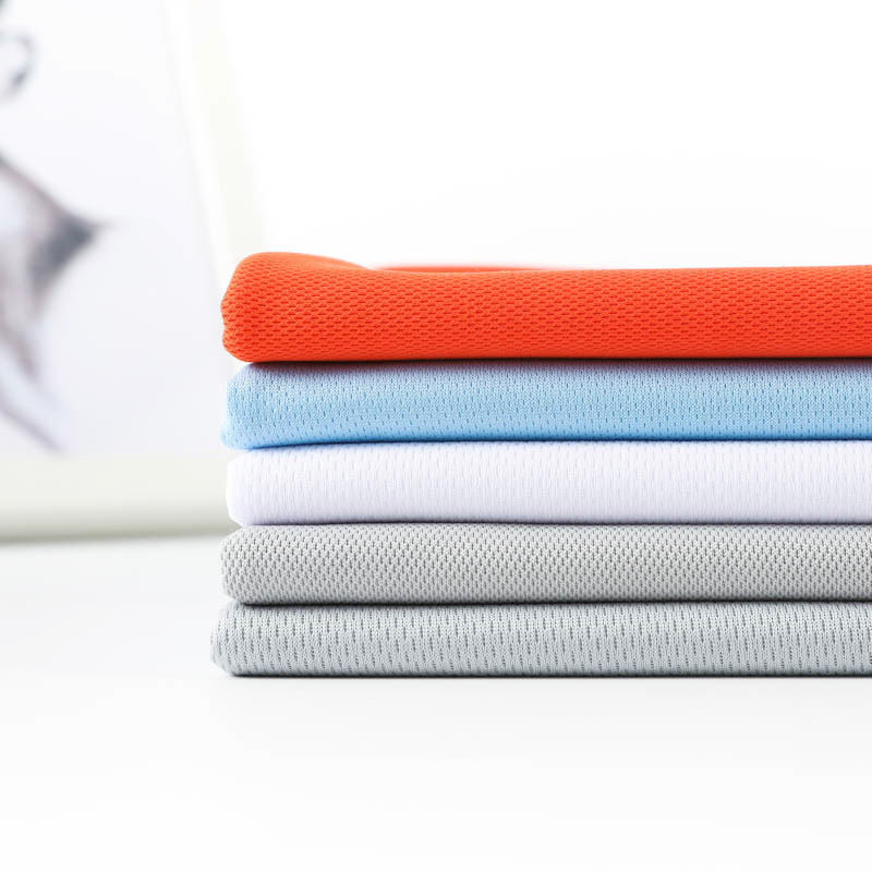 Paño ojo de pájaro secundario adecuado para ropa deportiva y camisetas publicitarias.